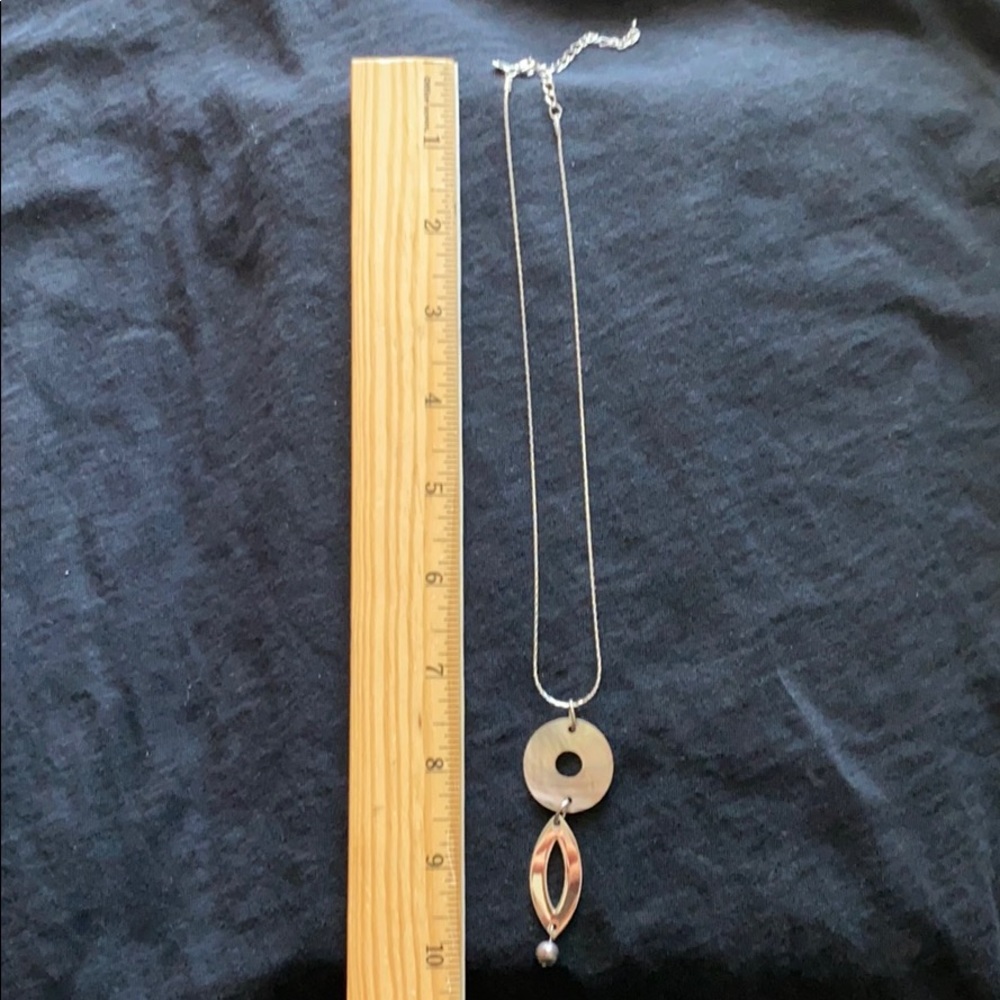 Silver necklace with shell and purple bead